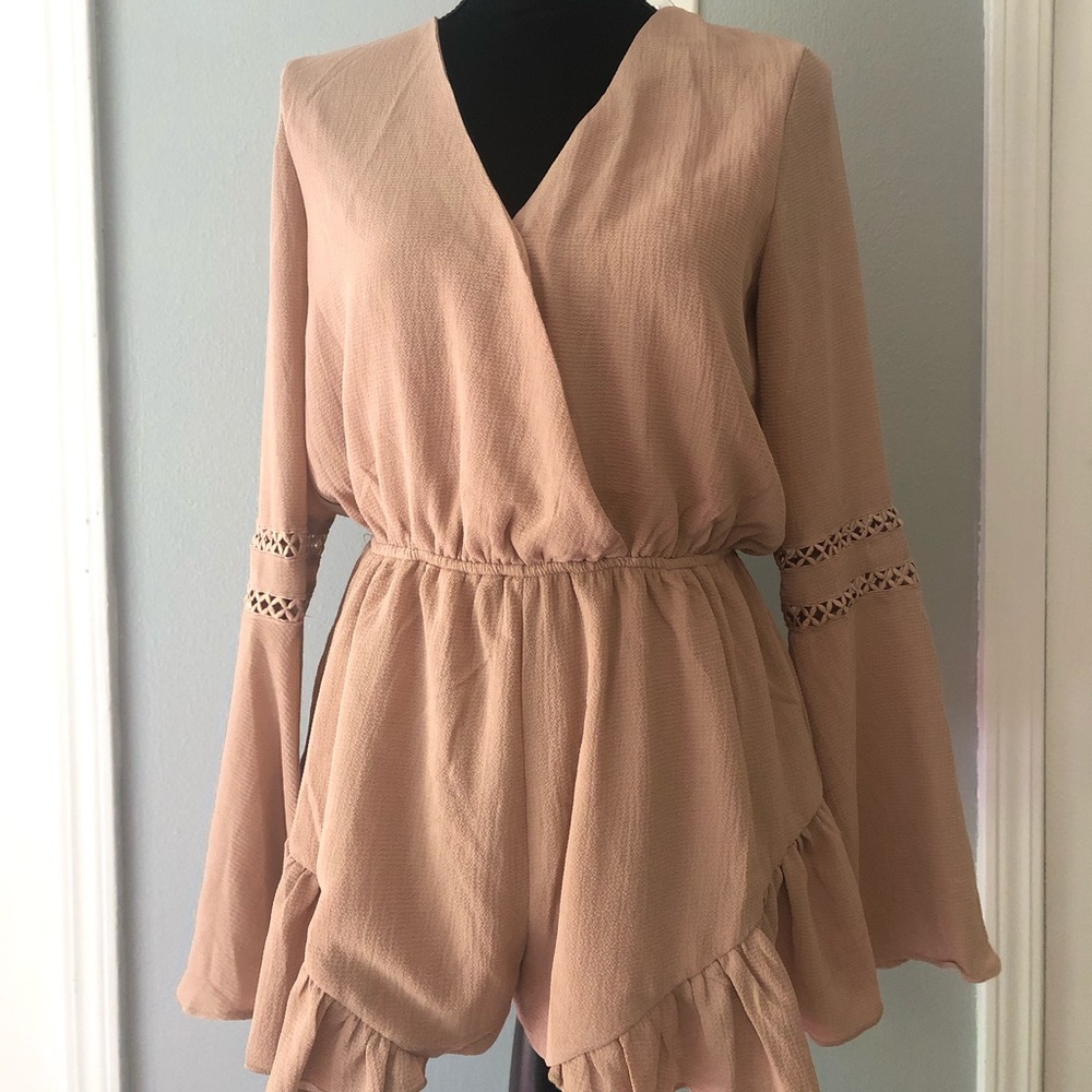 Romper. Never worn.